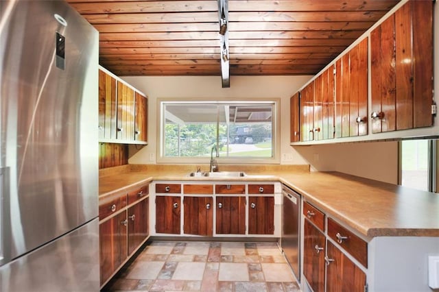 3861 Foxford Dr, Atlanta, GA 30340 - kitchen with appliances with stainless steel finishes, a sink, wood ceiling, light countertops, and brown cabinetry