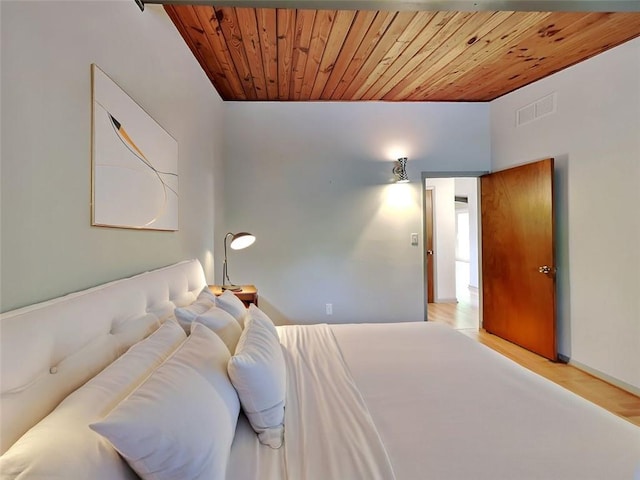3861 Foxford Dr, Atlanta, GA 30340 - bedroom featuring wood ceiling, light wood finished floors, and baseboards