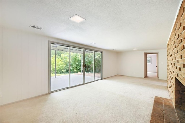 3861 Foxford Dr, Atlanta, GA 30340 - unfurnished living room featuring a fireplace, carpet, and a textured ceiling