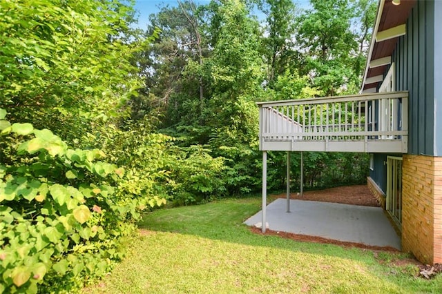 3861 Foxford Dr, Atlanta, GA 30340 - view of green lawn with a patio area and a deck