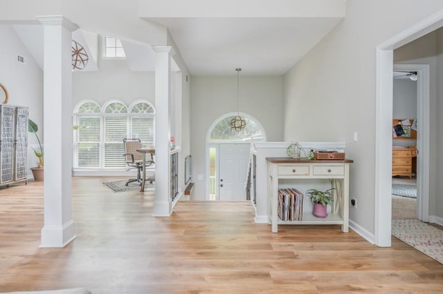 2045 Bethany Spring Trce, Cumming, GA 30041 - foyer entrance with ornate columns, plenty of natural light, and a towering ceiling
