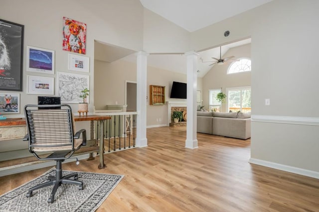 2045 Bethany Spring Trce, Cumming, GA 30041 - office with high vaulted ceiling, a ceiling fan, wood finished floors, ornate columns, and a fireplace with raised hearth