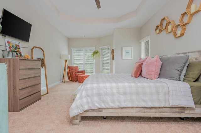 2045 Bethany Spring Trce, Cumming, GA 30041 - bedroom with light colored carpet, a raised ceiling, and ceiling fan