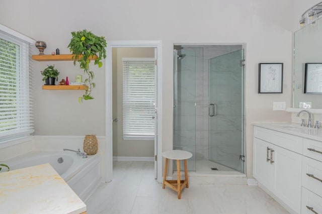 2045 Bethany Spring Trce, Cumming, GA 30041 - bathroom with vanity, marble look tiles, a stall shower, and a bath