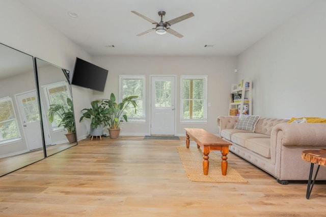 2045 Bethany Spring Trce, Cumming, GA 30041 - living room with light wood-style floors and a ceiling fan