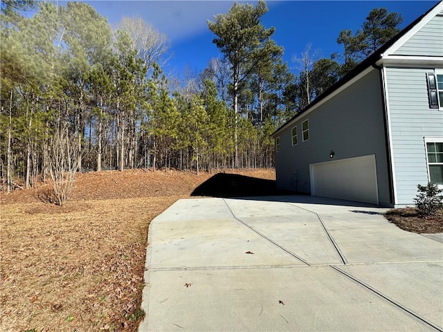 view of side of property with a garage