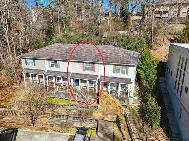 rear view of house featuring stairs