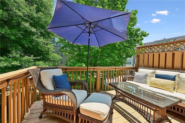 wooden deck with an outdoor living space