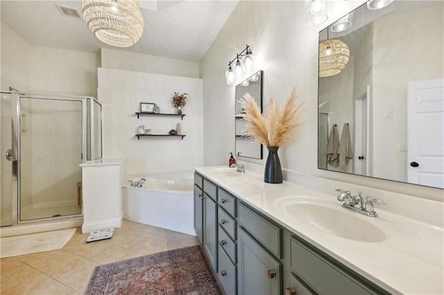 full bathroom featuring a sink, double vanity, a garden tub, and a shower stall