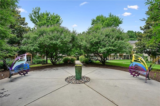 view of home's community with a patio area