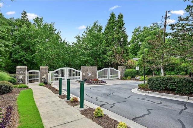 view of gate with fence