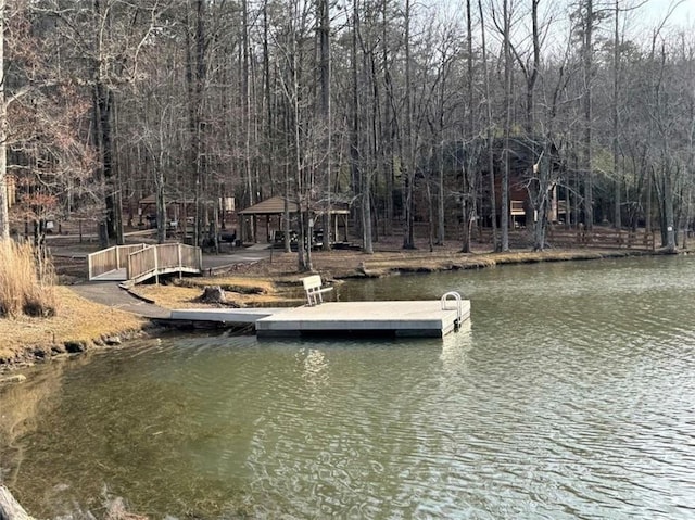 view of dock featuring a gazebo and a water view