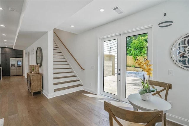 2809 Glenwood Ave SE, Atlanta, GA 30317 - foyer entrance with wood-type flooring, stairs, recessed lighting, baseboards, and french doors