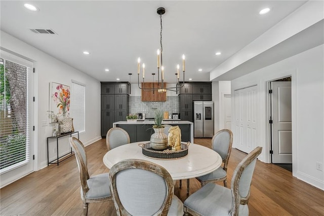 2809 Glenwood Ave SE, Atlanta, GA 30317 - dining area featuring plenty of natural light, light wood-style floors, baseboards, and recessed lighting