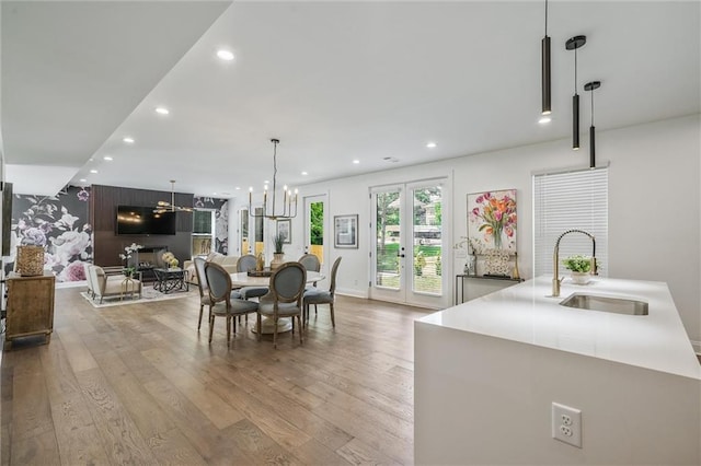 2809 Glenwood Ave SE, Atlanta, GA 30317 - dining space with recessed lighting, wood finished floors, baseboards, and a chandelier