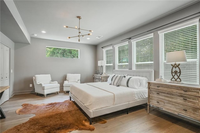 2809 Glenwood Ave SE, Atlanta, GA 30317 - bedroom featuring a chandelier, light wood-style floors, recessed lighting, and baseboards