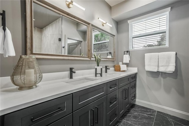 2809 Glenwood Ave SE, Atlanta, GA 30317 - bathroom featuring marble finish flooring, baseboards, and double vanity