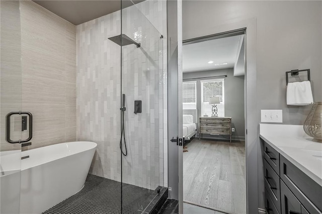 2809 Glenwood Ave SE, Atlanta, GA 30317 - ensuite bathroom featuring a stall shower, a freestanding bath, and vanity