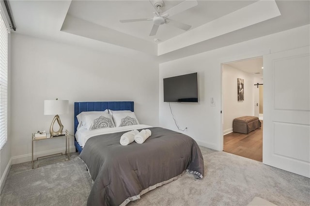 2809 Glenwood Ave SE, Atlanta, GA 30317 - carpeted bedroom featuring a raised ceiling, baseboards, and ceiling fan