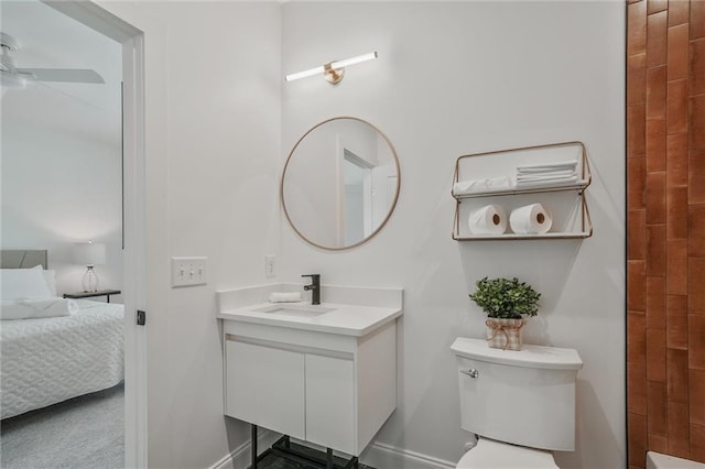 2809 Glenwood Ave SE, Atlanta, GA 30317 - bathroom with vanity, ensuite bath, a ceiling fan, toilet, and baseboards
