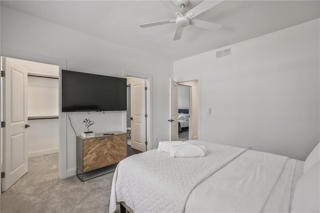 2809 Glenwood Ave SE, Atlanta, GA 30317 - bedroom with carpet floors, a ceiling fan, a walk in closet, and baseboards