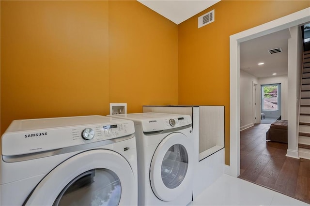 2809 Glenwood Ave SE, Atlanta, GA 30317 - laundry area with washing machine and dryer, wood finished floors, baseboards, and recessed lighting