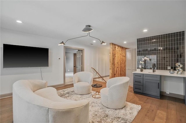 2809 Glenwood Ave SE, Atlanta, GA 30317 - sitting room with light wood-type flooring, baseboards, recessed lighting, and bar area