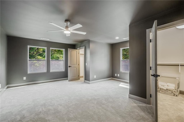 2809 Glenwood Ave SE, Atlanta, GA 30317 - unfurnished bedroom with carpet flooring, multiple windows, baseboards, and a ceiling fan