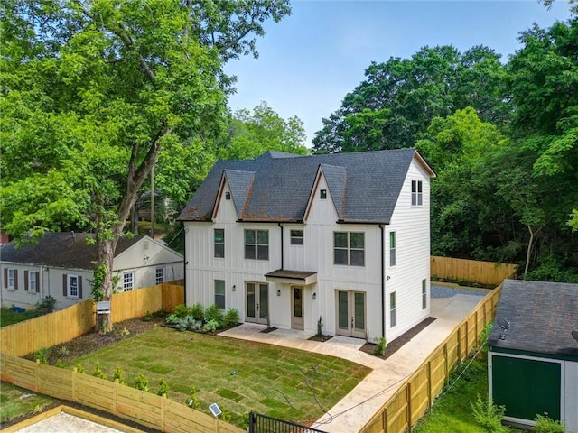2809 Glenwood Ave SE, Atlanta, GA 30317 - modern inspired farmhouse featuring french doors, board and batten siding, roof with shingles, and a patio area