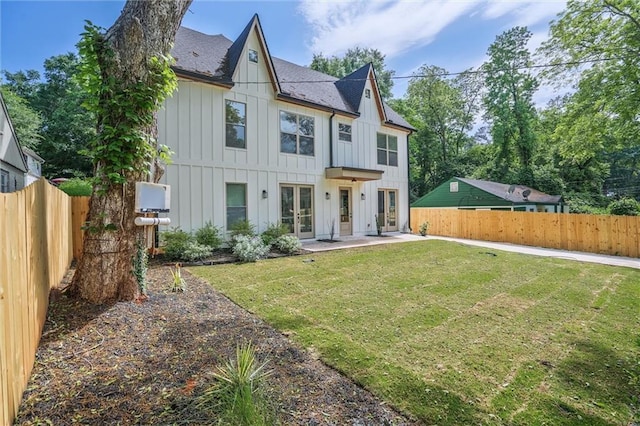 2809 Glenwood Ave SE, Atlanta, GA 30317 - rear view of property featuring french doors, board and batten siding, roof with shingles, and a patio