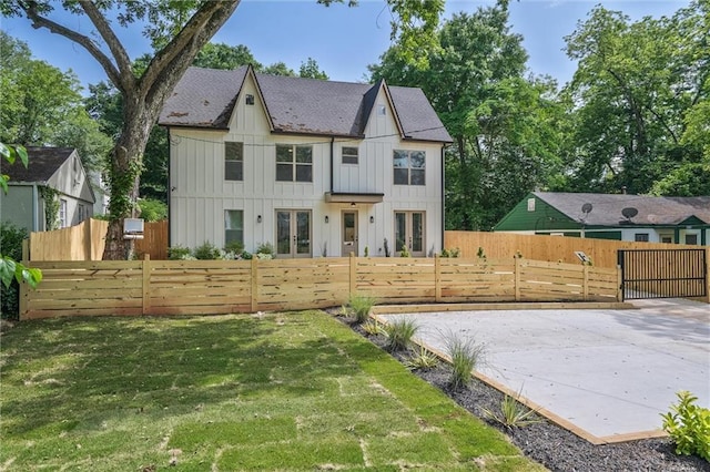 2809 Glenwood Ave SE, Atlanta, GA 30317 - rear view of property featuring french doors, board and batten siding, and a gate