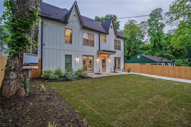 2809 Glenwood Ave SE, Atlanta, GA 30317 - view of front of house featuring french doors, board and batten siding, a shingled roof, and a patio area