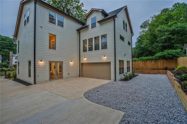 2809 Glenwood Ave SE, Atlanta, GA 30317 - view of front of house featuring french doors, concrete driveway, and an attached garage