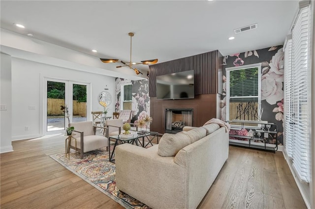 2809 Glenwood Ave SE, Atlanta, GA 30317 - living room with wood finished floors, recessed lighting, baseboards, french doors, and a fireplace