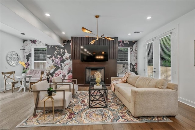 2809 Glenwood Ave SE, Atlanta, GA 30317 - living room with baseboards, wood finished floors, recessed lighting, a chandelier, and french doors