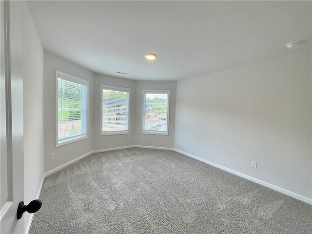 empty room featuring carpet floors