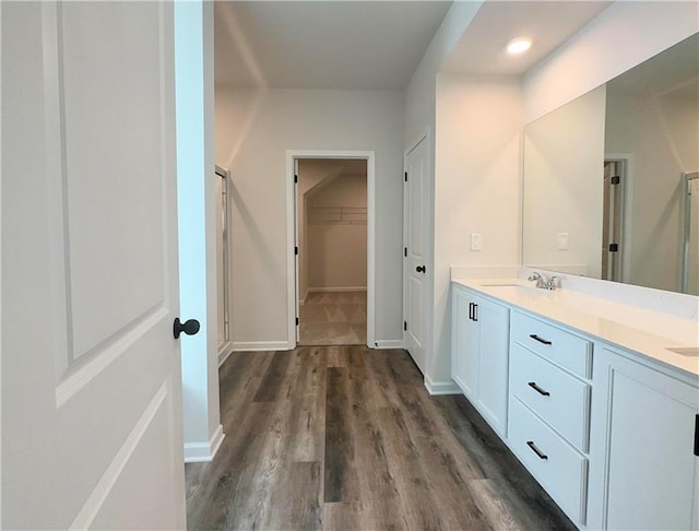 bathroom featuring vanity and hardwood / wood-style flooring