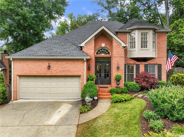 350 Fountain Oaks Ln, Atlanta, GA 30342 - traditional-style home with french doors, brick siding, concrete driveway, and a garage