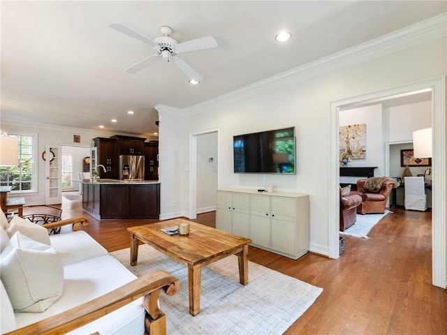350 Fountain Oaks Ln, Atlanta, GA 30342 - living area with ornamental molding, recessed lighting, light wood-type flooring, and ceiling fan