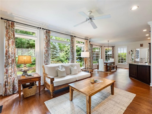 350 Fountain Oaks Ln, Atlanta, GA 30342 - living room with ornamental molding, a ceiling fan, wood finished floors, recessed lighting, and a chandelier