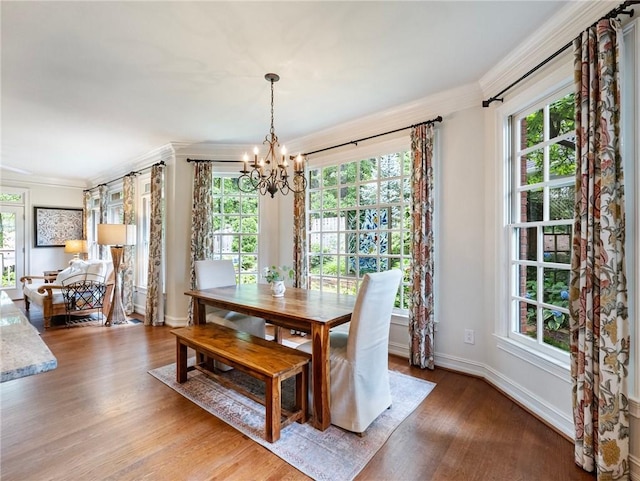 350 Fountain Oaks Ln, Atlanta, GA 30342 - dining area with a chandelier, crown molding, and light wood-style flooring