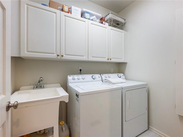 350 Fountain Oaks Ln, Atlanta, GA 30342 - laundry area featuring independent washer and dryer and cabinet space