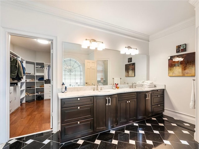 350 Fountain Oaks Ln, Atlanta, GA 30342 - bathroom with double vanity, granite tiled floors, ornamental molding, and a walk in closet
