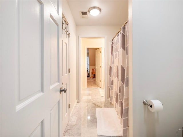 350 Fountain Oaks Ln, Atlanta, GA 30342 - bathroom featuring marble tiled floors and a shower with curtain