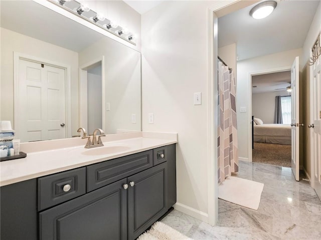 350 Fountain Oaks Ln, Atlanta, GA 30342 - bathroom featuring marble finish flooring, vanity, ensuite bath, and a ceiling fan