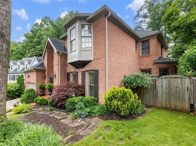 350 Fountain Oaks Ln, Atlanta, GA 30342 - view of side of property featuring brick siding and a garage