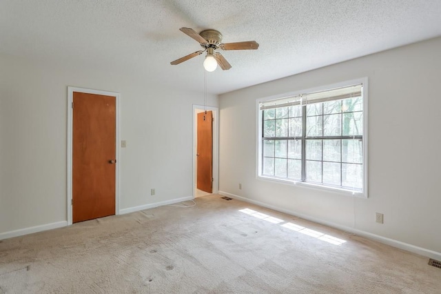 798 Tommy Lee Cook Rd, Palmetto, GA 30268 - unfurnished bedroom featuring a textured ceiling, carpet floors, and a ceiling fan