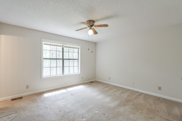 798 Tommy Lee Cook Rd, Palmetto, GA 30268 - unfurnished room with a ceiling fan, light carpet, and a textured ceiling