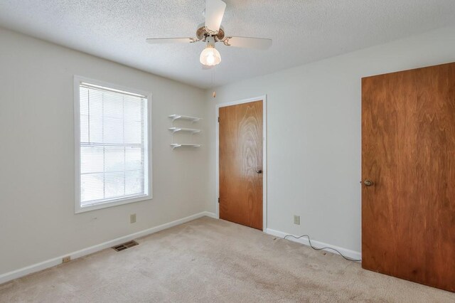 798 Tommy Lee Cook Rd, Palmetto, GA 30268 - unfurnished bedroom featuring carpet flooring, a textured ceiling, and ceiling fan