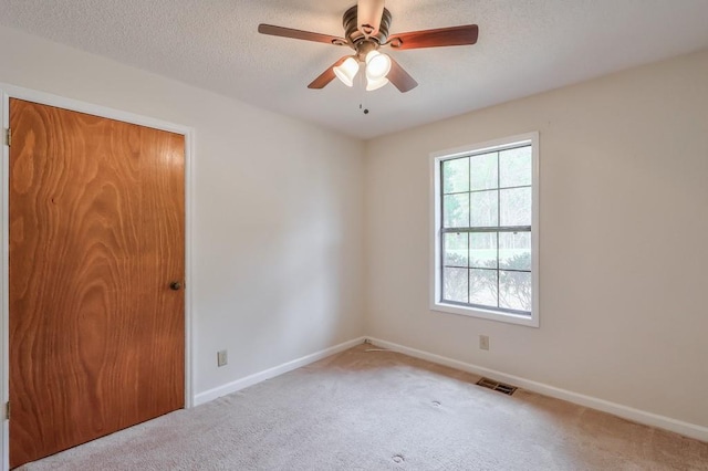798 Tommy Lee Cook Rd, Palmetto, GA 30268 - carpeted spare room with a ceiling fan and a textured ceiling